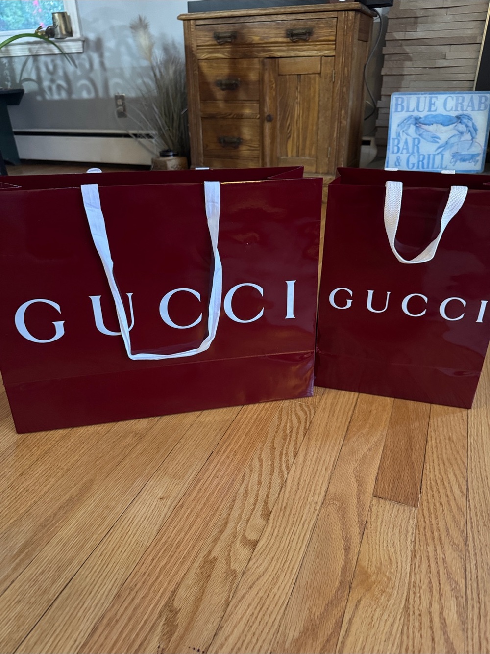 Two Gucci shopping bags